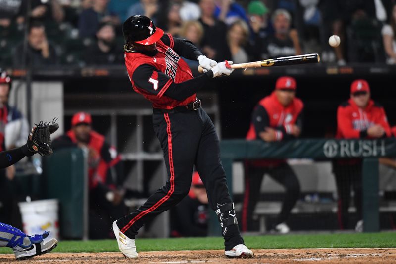 Jun 6, 2025; Chicago, Illinois, USA; Chicago White Sox center fielder Luis Robert Jr. (88) hits a two-run single during the eighth inning against the Kansas City Royals at Rate Field. Mandatory Credit: Patrick Gorski-Imagn Images