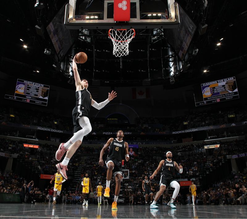 MEMPHIS, TN - APRIL 12: Jake LaRavia #3 of the Memphis Grizzlies drives to the basket during the game against the Los Angeles Lakers on April 12, 2024 at FedExForum in Memphis, Tennessee. NOTE TO USER: User expressly acknowledges and agrees that, by downloading and or using this photograph, User is consenting to the terms and conditions of the Getty Images License Agreement. Mandatory Copyright Notice: Copyright 2024 NBAE (Photo by Joe Murphy/NBAE via Getty Images)