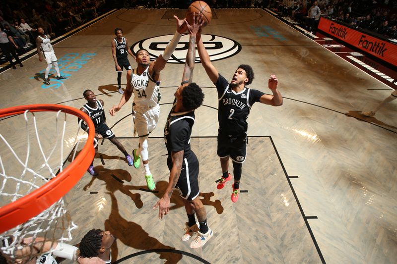 BROOKLYN, NY - DECEMBER 8: Cameron Johnson #2, Keon Johnson #45 of the Brooklyn Nets, and Giannis Antetokounmpo #34 of the Milwaukee Bucks battle for a rebound during the game on December 8, 2024 at Barclays Center in Brooklyn, New York. NOTE TO USER: User expressly acknowledges and agrees that, by downloading and or using this Photograph, user is consenting to the terms and conditions of the Getty Images License Agreement. Mandatory Copyright Notice: Copyright 2024 NBAE (Photo by Nathaniel S. Butler/NBAE via Getty Images)