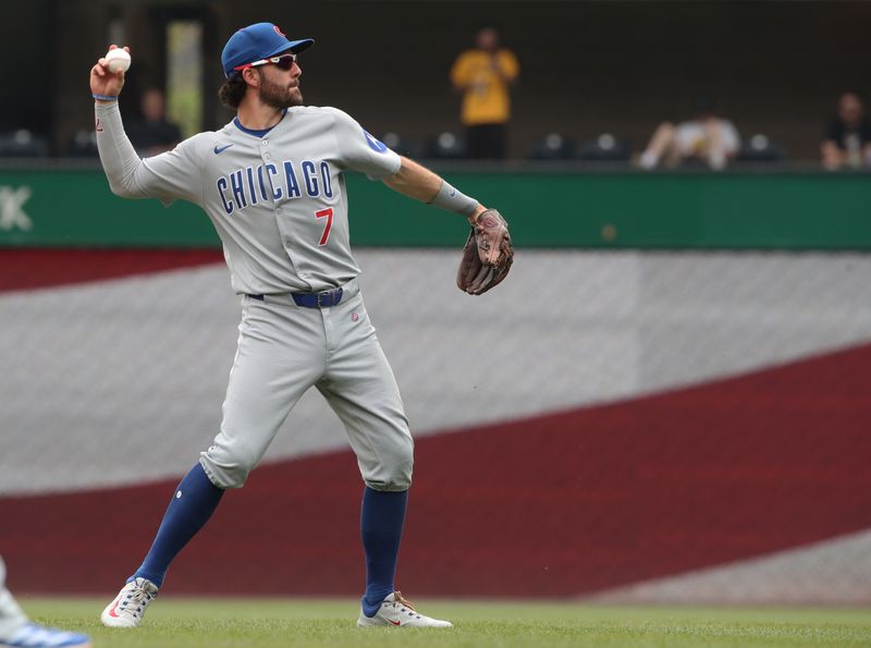 May 1, 2025; Pittsburgh, Pennsylvania, USA;  Chicago Cubs shortstop Dansby Swanson (7) warms up before the bottom of the third inning against the Pittsburgh Pirates at PNC Park. Mandatory Credit: Charles LeClaire-Imagn Images