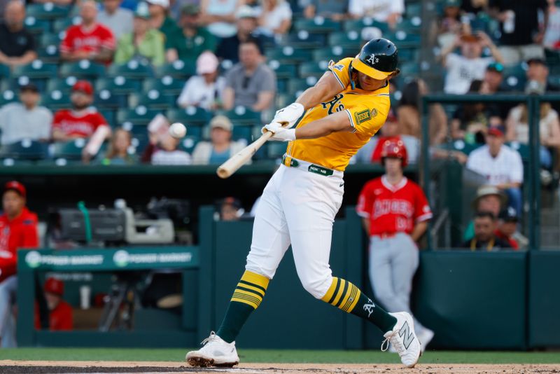 May 20, 2025; West Sacramento, California, USA; Athletics first baseman Nick Kurtz (16) hits a single during the second inning against the Los Angeles Angels at Sutter Health Park. Mandatory Credit: Sergio Estrada-Imagn Images