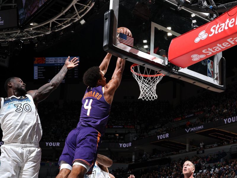 MINNEAPOLIS, MN - NOVEMBER 17: Oso Ighodaro #4 of the Phoenix Suns dunks the ball during the game against the Minnesota Timberwolves on November 17, 2024 at Target Center in Minneapolis, Minnesota. NOTE TO USER: User expressly acknowledges and agrees that, by downloading and or using this Photograph, user is consenting to the terms and conditions of the Getty Images License Agreement. Mandatory Copyright Notice: Copyright 2024 NBAE(Photo by David Sherman/NBAE via Getty Images)