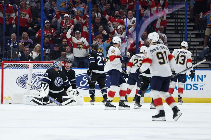 Feb 17, 2024; Tampa, Florida, USA;  the Florida Panthers celebrate after scoring a goal on Tampa Bay Lightning goaltender Andrei Vasilevskiy (88) in the third period at Amalie Arena. Mandatory Credit: Nathan Ray Seebeck-USA TODAY Sports