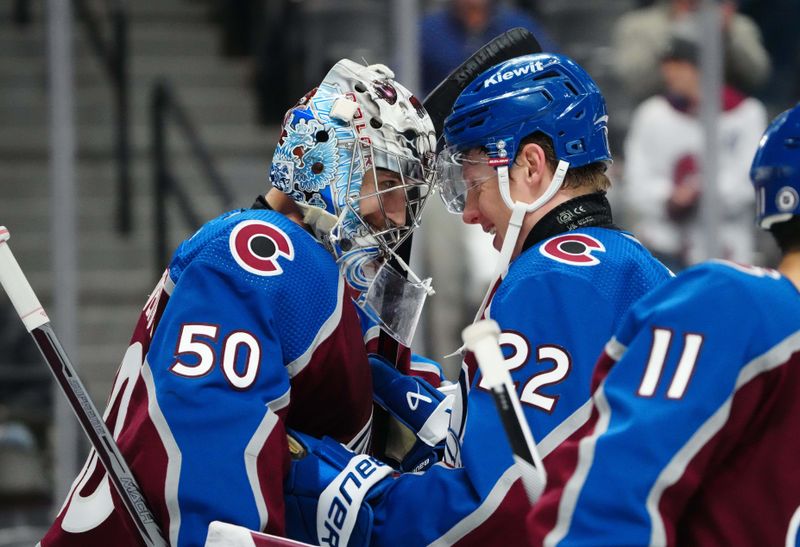 Dec 13, 2023; Denver, Colorado, USA; Colorado Avalanche goaltender Ivan Prosvetov (50) and left wing Fredrik Olofsson (22) celebrate the win over the Buffalo Sabres t Ball Arena. Mandatory Credit: Ron Chenoy-USA TODAY Sports