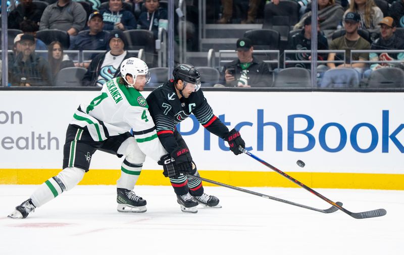 Nov 26, 2025; Seattle, Washington, USA; Seattle Kraken forward Jordan Eberle (7) skates against Dallas Stars defenseman Miro Heiskanen (4) during the second period at Climate Pledge Arena. Mandatory Credit: Stephen Brashear-Imagn Images
