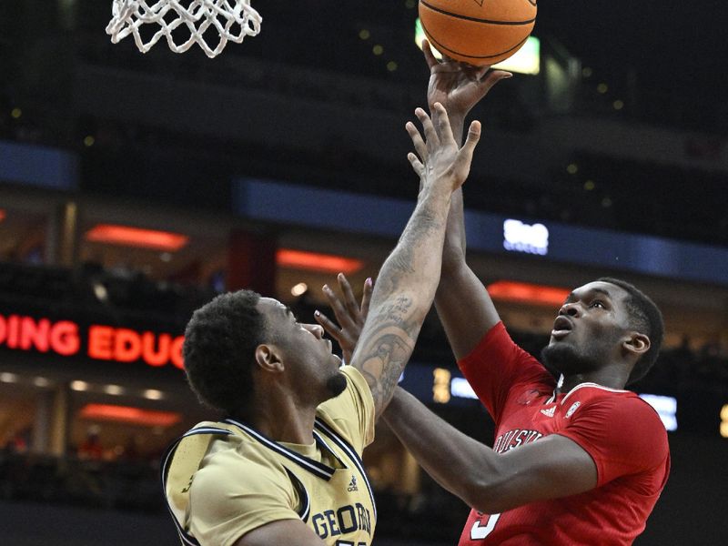 Feb 10, 2024; Louisville, Kentucky, USA; Louisville Cardinals forward Brandon Huntley-Hatfield (5) shoots against Georgia Tech Yellow Jackets guard Miles Kelly (13) during the second half at KFC Yum! Center. Louisville defeated Georgia Tech 79-67. Mandatory Credit: Jamie Rhodes-USA TODAY Sports