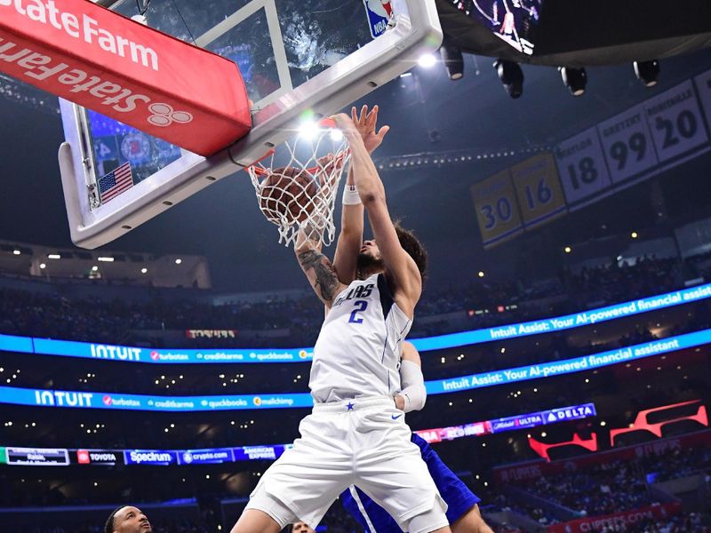 LOS ANGELES, CA - APRIL 21:  Dereck Lively II #2 of the Dallas Mavericks dunks the ball against the LA Clippers during Round 1 Game 1 of the 2024 NBA Playoffs on April 21, 2024 at Crypto.Com Arena in Los Angeles, California. NOTE TO USER: User expressly acknowledges and agrees that, by downloading and/or using this Photograph, user is consenting to the terms and conditions of the Getty Images License Agreement. Mandatory Copyright Notice: Copyright 2024 NBAE (Photo by Adam Pantozzi/NBAE via Getty Images)