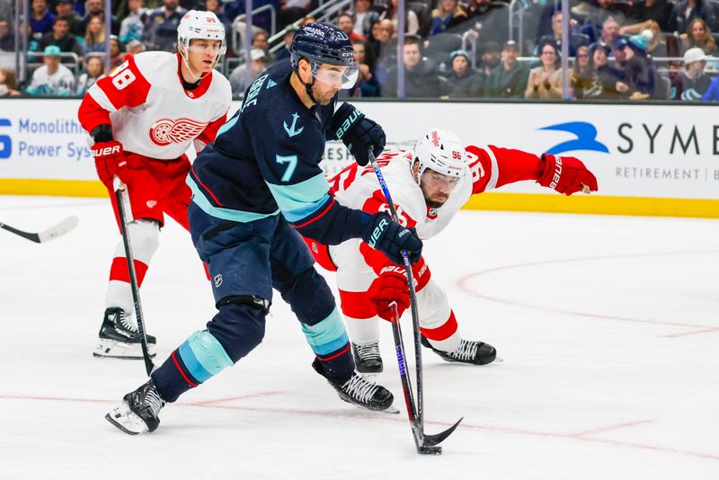Feb 19, 2024; Seattle, Washington, USA; Detroit Red Wings defenseman Jake Walman (96) disrupts a shot attempt by Seattle Kraken right wing Jordan Eberle (7) during the second period at Climate Pledge Arena. Mandatory Credit: Joe Nicholson-USA TODAY Sports