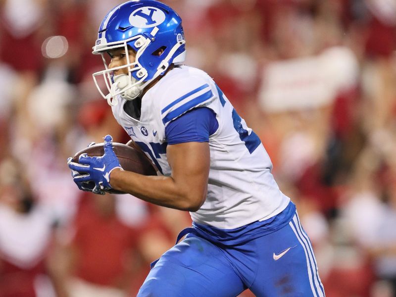 Sep 16, 2023; Fayetteville, Arkansas, USA; BYU Cougars running back LJ Martin (27) rushes in the second quarter against the Arkansas Razorbacks at Donald W. Reynolds Razorback Stadium. Mandatory Credit: Nelson Chenault-USA TODAY Sports