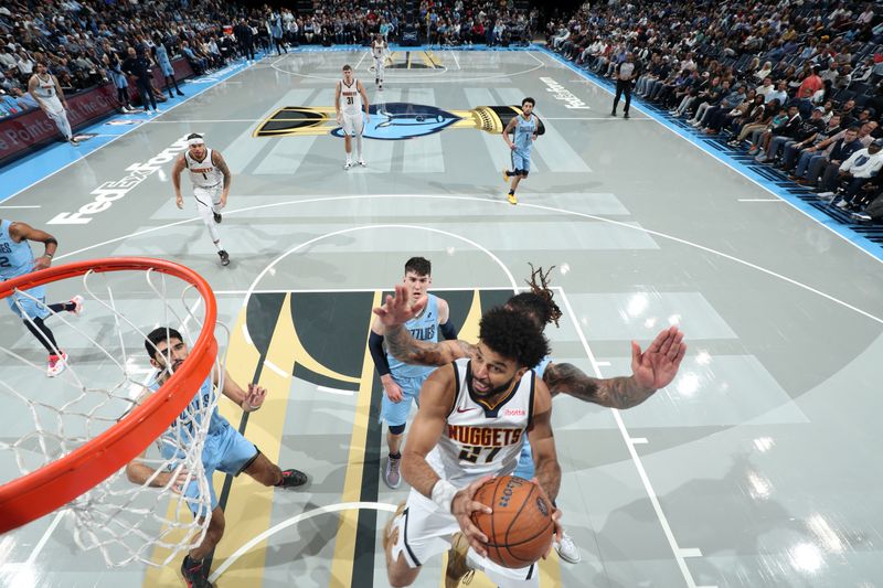 MEMPHIS, TN - NOVEMBER 19: Jamal Murray #27 of the Denver Nuggets drives to the basket during the game against the Memphis Grizzlies during the Emirates NBA Cup game on November 19, 2024 at FedExForum in Memphis, Tennessee. NOTE TO USER: User expressly acknowledges and agrees that, by downloading and or using this photograph, User is consenting to the terms and conditions of the Getty Images License Agreement. Mandatory Copyright Notice: Copyright 2024 NBAE (Photo by Joe Murphy/NBAE via Getty Images)