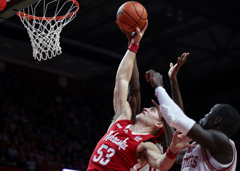 Jan 17, 2024; Piscataway, New Jersey, USA; Nebraska Cornhuskers forward Josiah Allick (53) rebounds against Rutgers Scarlet Knights forward Mawot Mag (3)  during the second half at Jersey Mike's Arena. Mandatory Credit: Vincent Carchietta-USA TODAY Sports