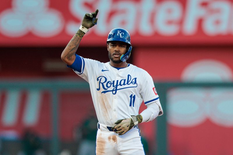 May 18, 2024; Kansas City, Missouri, USA; Kansas City Royals third base Maikel Garcia (11) motions to the dugout after a double during the fifth inning against the Oakland Athletics at Kauffman Stadium. Mandatory Credit: William Purnell-USA TODAY Sports