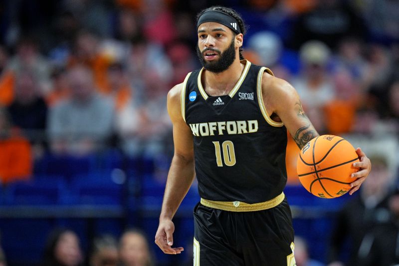 Mar 20, 2025; Lexington, KY, USA; Wofford Terriers guard Corey Tripp (10) brings the ball up court during the first half against the Tennessee Volunteers in the first round of the NCAA Tournament at Rupp Arena. Mandatory Credit: Aaron Doster-Imagn Images