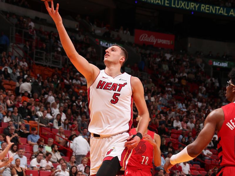 MIAMI, FL - MARCH 29: Nikola Jovic #5 of the Miami Heat drives to the basket during the game against the Portland Trail Blazers on March 29, 2024 at Kaseya Center in Miami, Florida. NOTE TO USER: User expressly acknowledges and agrees that, by downloading and or using this Photograph, user is consenting to the terms and conditions of the Getty Images License Agreement. Mandatory Copyright Notice: Copyright 2024 NBAE (Photo by Issac Baldizon/NBAE via Getty Images)