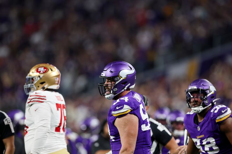 Minnesota Vikings defensive end Dean Lowry (94) reacts after a play during the first half of an NFL football game against the San Francisco 49ers, Monday, Oct. 23, 2023 in Minneapolis. (AP Photo/Stacy Bengs)