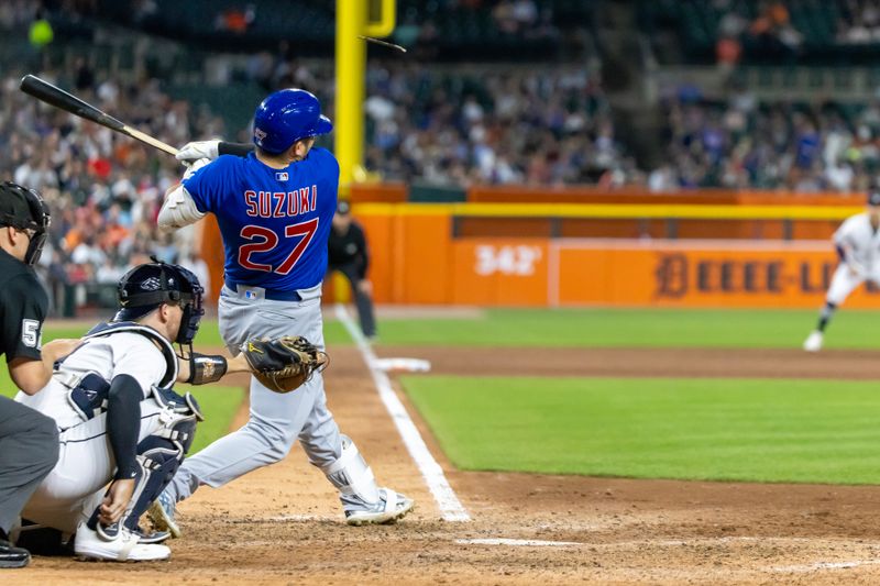 Aug 22, 2023; Detroit, Michigan, USA; Chicago Cubs right fielder Seiya Suzuki (27) hits a broken bat single in the eighth inning against the Detroit Tigers at Comerica Park. Mandatory Credit: David Reginek-USA TODAY Sports