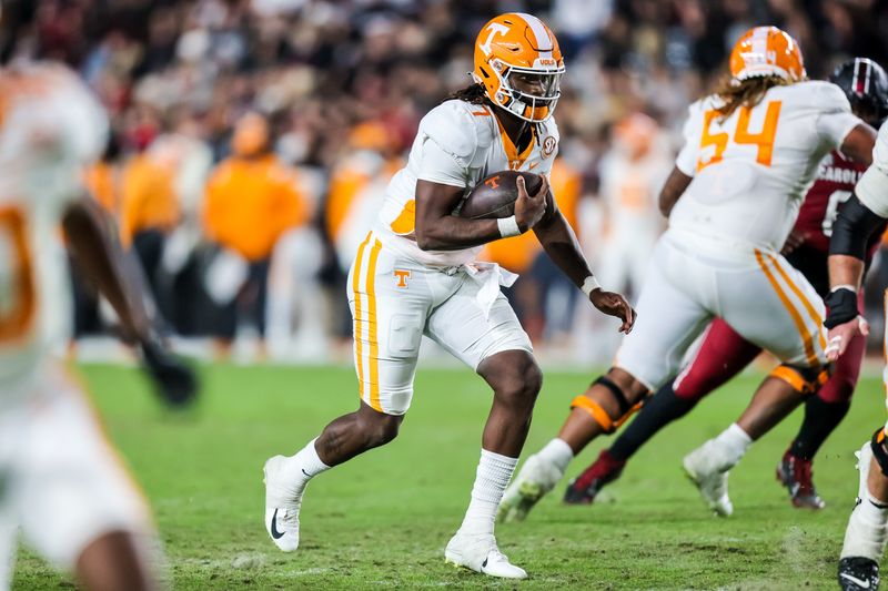 Nov 19, 2022; Columbia, South Carolina, USA; Tennessee Volunteers quarterback Joe Milton III (7) rushes against the South Carolina Gamecocks in the second half at Williams-Brice Stadium. Mandatory Credit: Jeff Blake-USA TODAY Sports