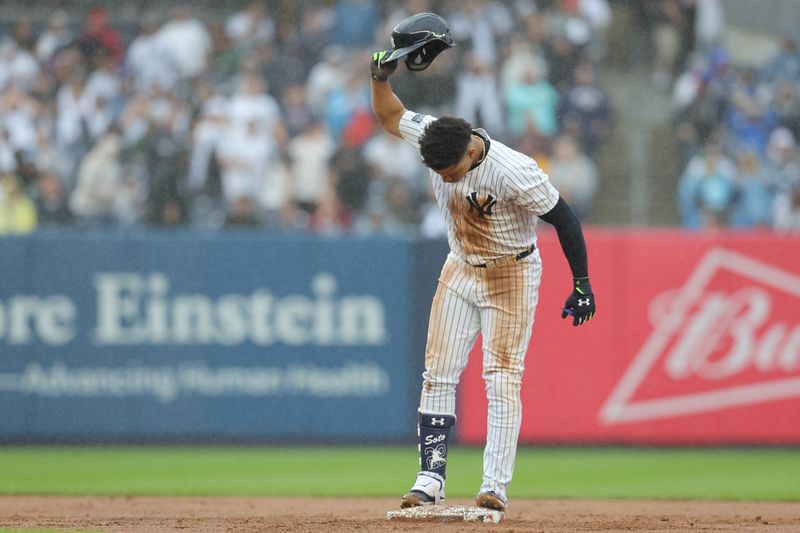 Sep 28, 2024; Bronx, New York, USA; New York Yankees right fielder Juan Soto (22) reacts after being tagged out trying to stretch his RBI single into a double during the seventh inning against the Pittsburgh Pirates at Yankee Stadium. Mandatory Credit: Brad Penner-Imagn Images