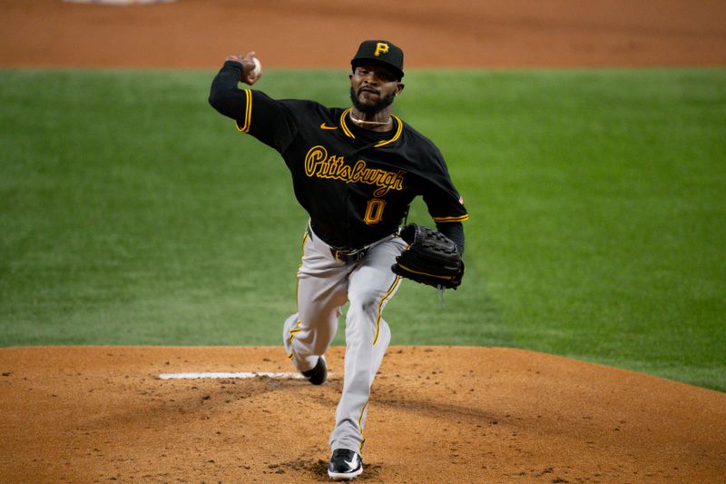 Aug 21, 2024; Arlington, Texas, USA; Pittsburgh Pirates starting pitcher Domingo German (0) pitches against the Texas Rangers during the first inning at Globe Life Field. Mandatory Credit: Jerome Miron-USA TODAY Sports