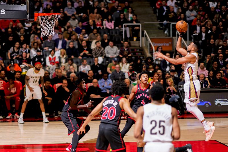 TORONTO, CANADA - FEBRUARY 23: CJ McCollum #3 of the New Orleans Pelicans goes to the basket against the Toronto Raptors on February 23, 2023 at the Scotiabank Arena in Toronto, Ontario, Canada.  NOTE TO USER: User expressly acknowledges and agrees that, by downloading and or using this Photograph, user is consenting to the terms and conditions of the Getty Images License Agreement.  Mandatory Copyright Notice: Copyright 2023 NBAE (Photo by Mark Blinch/NBAE via Getty Images)