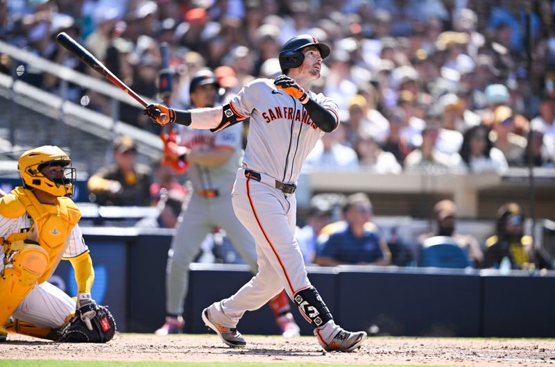 Apr 30, 2025; San Diego, California, USA; San Francisco Giants right fielder Mike Yastrzemski (5) hits a solo home run during the eighth inning against the San Diego Padres at Petco Park. Mandatory Credit: Denis Poroy-Imagn Images