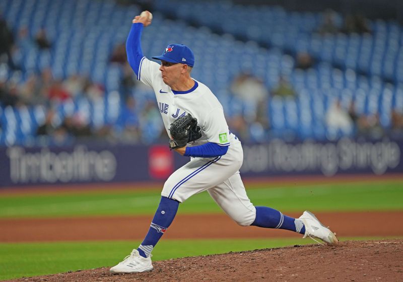 Sep 13, 2023; Toronto, Ontario, CAN; Toronto Blue Jays relief pitcher Chad Green (37) throws a pitch against the Texas Rangers during the ninth inning at Rogers Centre. Mandatory Credit: Nick Turchiaro-USA TODAY Sports