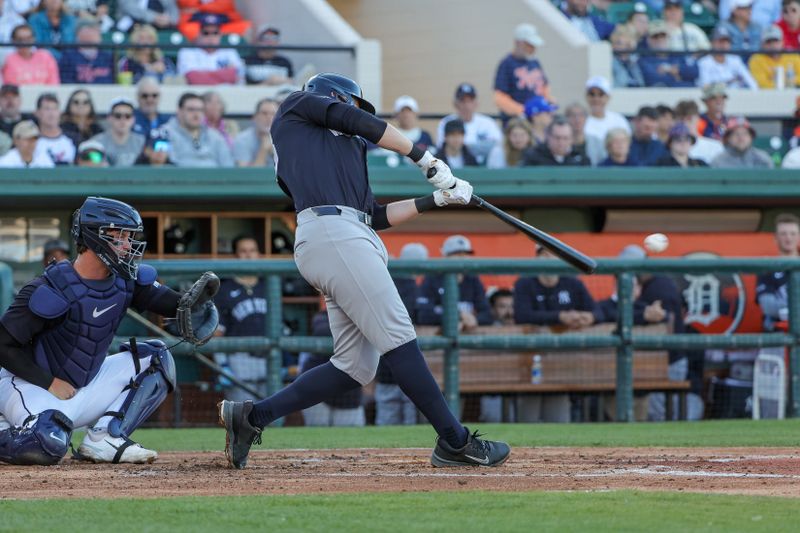 Mar 21, 2025; Lakeland, Florida, USA; New York Yankees first baseman Ben Rice (93) hits a double during the third inning against the Detroit Tigers at Publix Field at Joker Marchant Stadium. Mandatory Credit: Mike Watters-Imagn Images