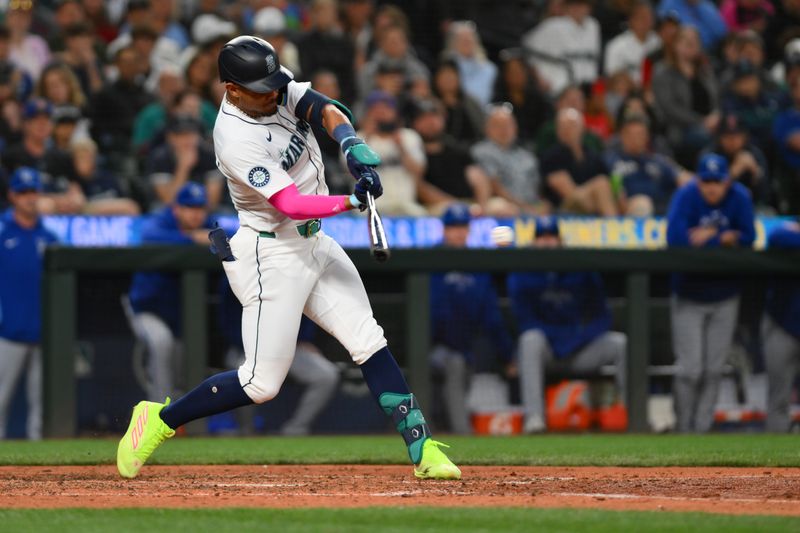 May 14, 2024; Seattle, Washington, USA; Seattle Mariners center fielder Julio Rodriguez (44) hits a single against the Kansas City Royals during the eighth inning at T-Mobile Park. Mandatory Credit: Steven Bisig-USA TODAY Sports