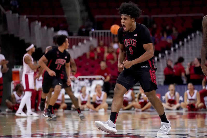 Feb 14, 2024; Fresno, California, USA; UNLV Rebels forward Rob Whaley Jr. (5) reacts after dunking the ball against the Fresno State Bulldogs in the second half at the Save Mart Center. Mandatory Credit: Cary Edmondson-USA TODAY Sports