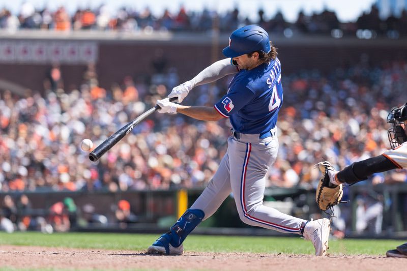 Aug 13, 2023; San Francisco, California, USA; Texas Rangers shortstop Josh Smith (47) hits a single during the tenth inning against the San Francisco Giants at Oracle Park. Mandatory Credit: Stan Szeto-USA TODAY Sports