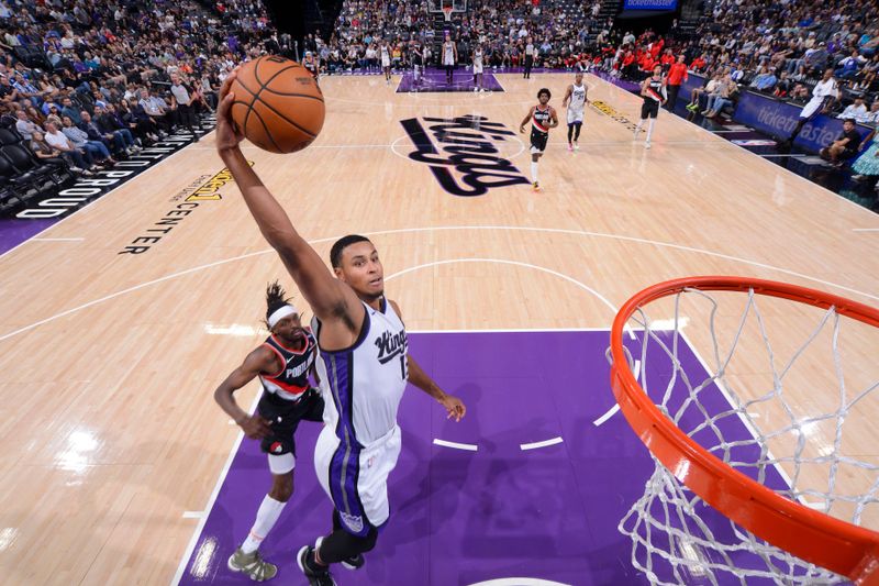 SACRAMENTO, CA - OCTOBER 13: Keegan Murray #13 of the Sacramento Kings dunks the ball during the game against the Portland Trail Blazers during a NBA preseason game on October 13, 2024 at Golden 1 Center in Sacramento, California. NOTE TO USER: User expressly acknowledges and agrees that, by downloading and or using this Photograph, user is consenting to the terms and conditions of the Getty Images License Agreement. Mandatory Copyright Notice: Copyright 2024 NBAE (Photo by Rocky Widner/NBAE via Getty Images)