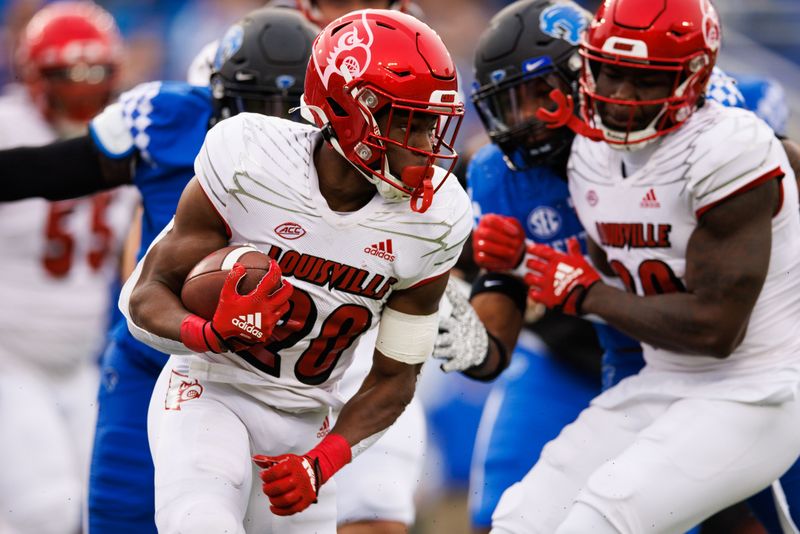 Nov 26, 2022; Lexington, Kentucky, USA; Louisville Cardinals running back Maurice Turner (20) carries the ball against the Kentucky Wildcats during the first quarter at Kroger Field. Mandatory Credit: Jordan Prather-USA TODAY Sports