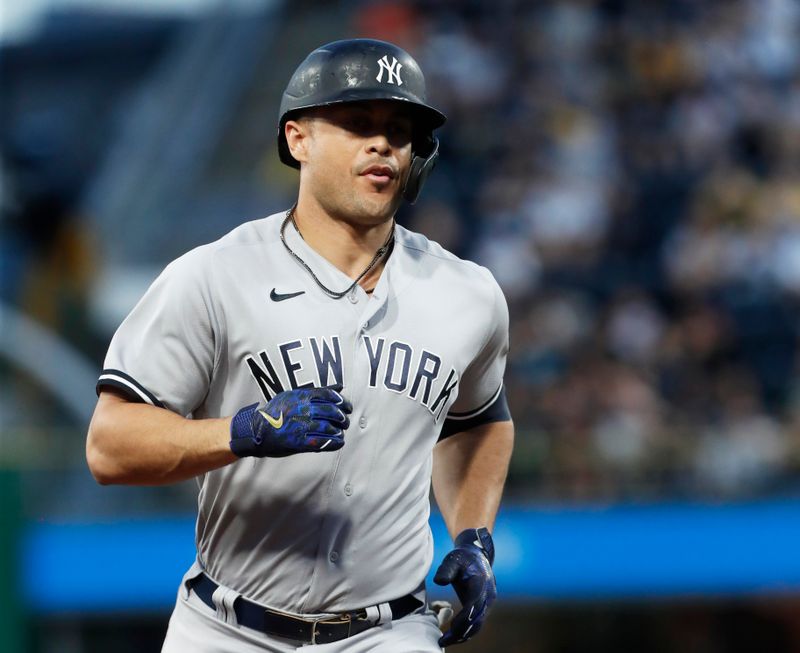 Sep 16, 2023; Pittsburgh, Pennsylvania, USA; New York Yankees designated hitter Giancarlo Stanton (27) circles the bases on a solo home run against the Pittsburgh Pirates during the third inning at PNC Park. Mandatory Credit: Charles LeClaire-USA TODAY Sports