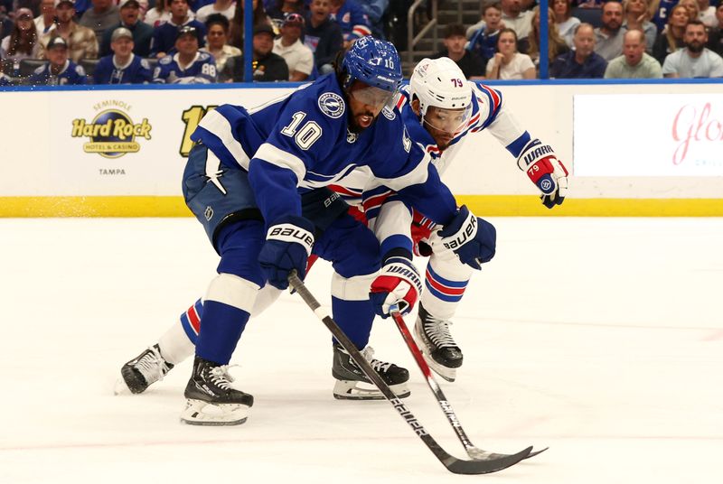 Mar 14, 2024; Tampa, Florida, USA; Tampa Bay Lightning left wing Anthony Duclair (10) skates with the puck as New York Rangers defenseman K'Andre Miller (79) defends during the third period at Amalie Arena. Mandatory Credit: Kim Klement Neitzel-USA TODAY Sports