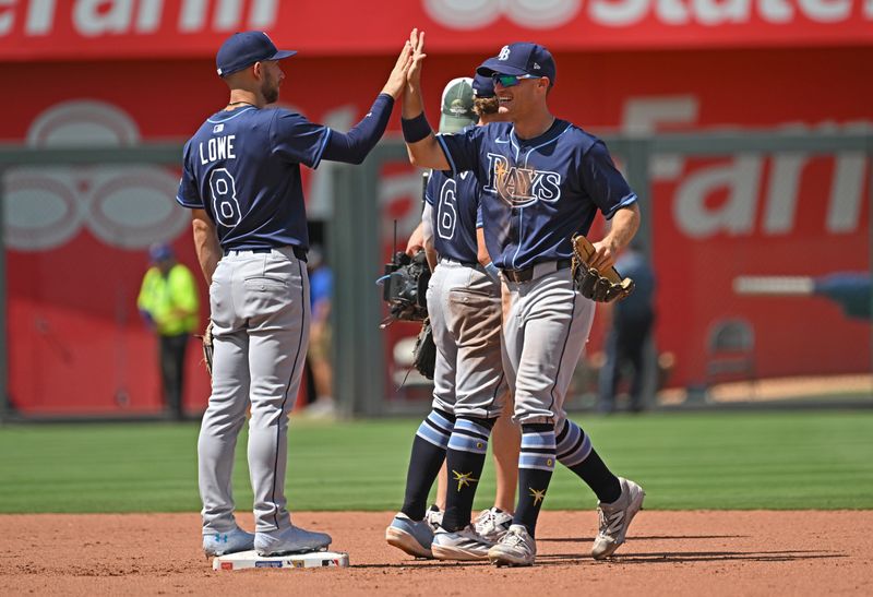 Jun 26, 2025; Kansas City, Missouri, USA;  Tampa Bay Rays left fielder Jake Mangum (28) celebrates with teammate second base Brandon Lowe (8) after beating the Kansas City Royals at Kauffman Stadium. Mandatory Credit: Peter Aiken-Imagn Images