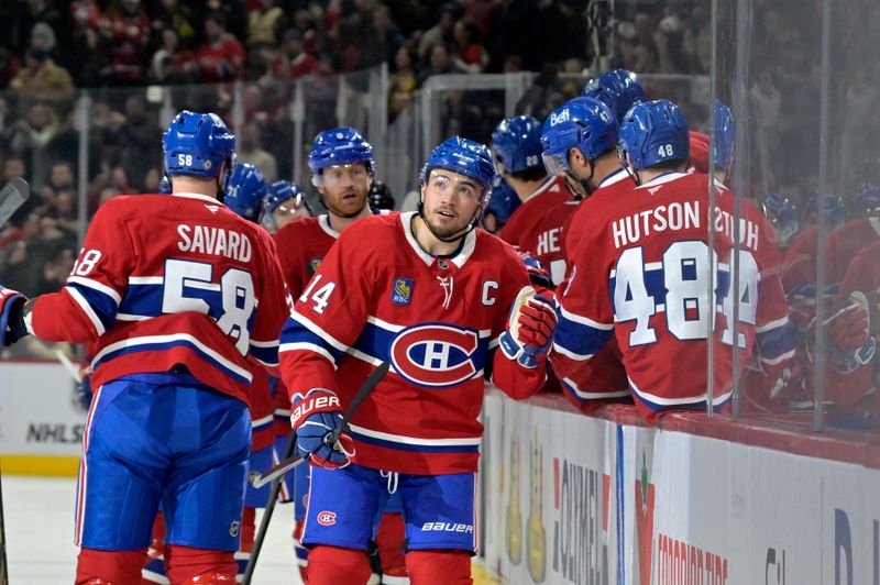 Mar 3, 2025; Montreal, Quebec, CAN; Montreal Canadiens forward Nick Suzuki (14) celebrates with teammates after scoring a goal against the Buffalo Sabres during the first period at the Bell Centre. Mandatory Credit: Eric Bolte-Imagn Images