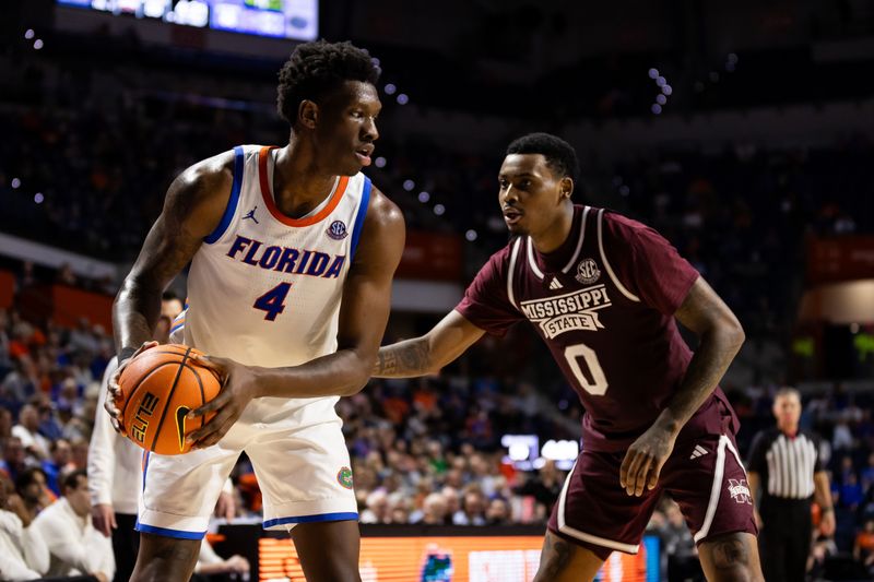 Jan 24, 2024; Gainesville, Florida, USA; Florida Gators forward Tyrese Samuel (4) looks to pass from Mississippi State Bulldogs forward D.J. Jeffries (0) during the second half at Exactech Arena at the Stephen C. O'Connell Center. Mandatory Credit: Matt Pendleton-USA TODAY Sports