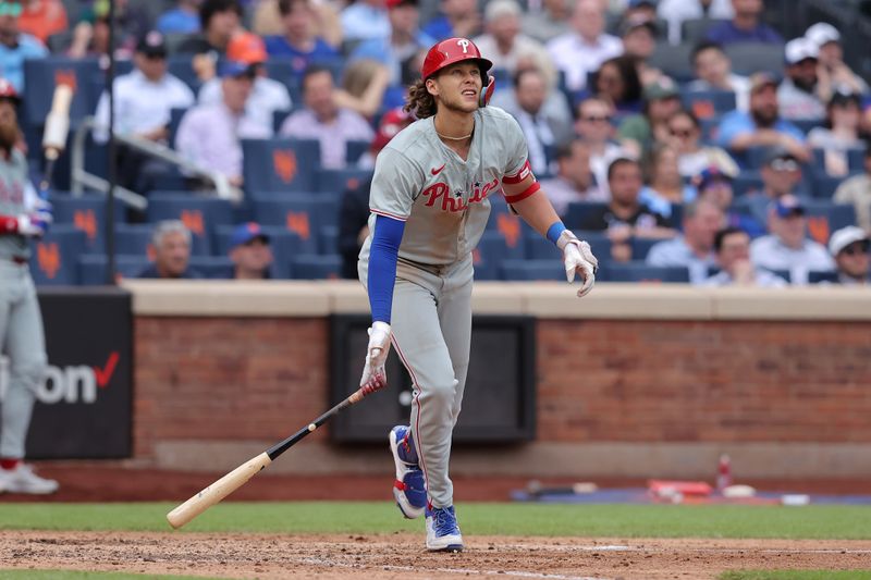 May 14, 2024; New York City, New York, USA; Philadelphia Phillies third baseman Alec Bohm (28) follows through on an RBI ground-rule double during the ninth inning against the New York Mets at Citi Field. Mandatory Credit: Brad Penner-USA TODAY Sports