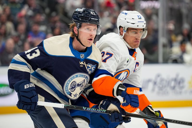 Feb 28, 2026; Columbus, Ohio, USA;  Columbus Blue Jackets left wing Danton Heinen (43) skates against New York Islanders left wing Anders Lee (27) in the first period at Nationwide Arena. Mandatory Credit: Aaron Doster-Imagn Images
