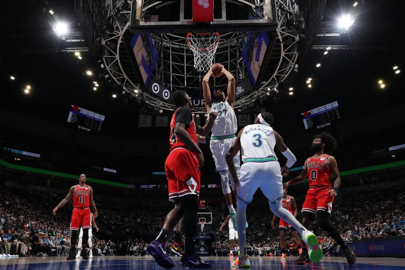 MINNEAPOLIS, MN -  MARCH 31: Rudy Gobert #27 of the Minnesota Timberwolves handles the ball during the game against the Chicago Bulls on March 31, 2024 at Target Center in Minneapolis, Minnesota. NOTE TO USER: User expressly acknowledges and agrees that, by downloading and or using this Photograph, user is consenting to the terms and conditions of the Getty Images License Agreement. Mandatory Copyright Notice: Copyright 2024 NBAE (Photo by Jordan Johnson/NBAE via Getty Images)