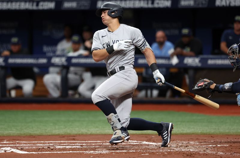 Aug 25, 2023; St. Petersburg, Florida, USA; New York Yankees shortstop Anthony Volpe (11) singles against the Tampa Bay Rays during the second inning at Tropicana Field. Mandatory Credit: Kim Klement Neitzel-USA TODAY Sports