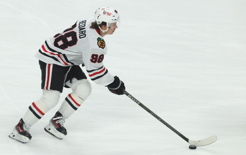 Apr 8, 2025; Pittsburgh, Pennsylvania, USA;  Chicago Blackhawks center Connor Bedard (98) warms up before the game against the Pittsburgh Penguins at PPG Paints Arena. Mandatory Credit: Charles LeClaire-Imagn Images