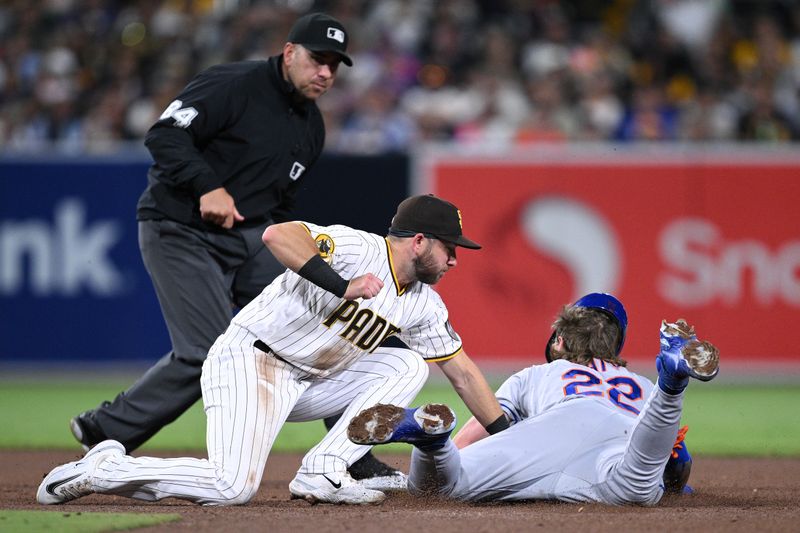 Jul 8, 2023; San Diego, California, USA; New York Mets third baseman Brett Baty (22) is tagged out by San Diego Padres second baseman Matthew Batten (17) attempting to steal second base during the fifth inning at Petco Park. Mandatory Credit: Orlando Ramirez-USA TODAY Sports