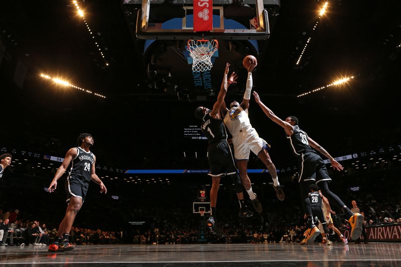 BROOKLYN, NY - FEBRUARY 5: Jonathan Kuminga #00 of the Golden State Warriors shoots the ball during the game against the Brooklyn Nets  on February 5, 2024 at Barclays Center in Brooklyn, New York. NOTE TO USER: User expressly acknowledges and agrees that, by downloading and or using this Photograph, user is consenting to the terms and conditions of the Getty Images License Agreement. Mandatory Copyright Notice: Copyright 2024 NBAE (Photo by Nathaniel S. Butler/NBAE via Getty Images)