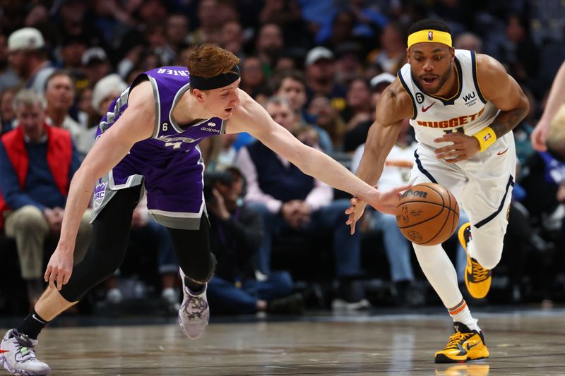 DENVER, CO - APRIL 09: Kevin Huerter #9 of the Sacramento Kings and Bruce Brown #11 of the Denver Nuggets reach for the ball during the second half of the game at Ball Arena on April 9, 2023 in Denver, Colorado. NOTE TO USER: User expressly acknowledges and agrees that, by downloading and or using this photograph, User is consenting to the terms and conditions of the Getty Images License Agreement. (Photo by Grace Bradley/Getty Images)