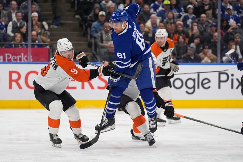 Mar 2, 2026; Toronto, Ontario, CAN; Toronto Maple Leafs forward Dakota Joshua (81) jumps out of the way of a shot as Philadelphia Flyers defenseman Jamie Drysdale (9) helps defend during the first period at Scotiabank Arena. Mandatory Credit: John E. Sokolowski-Imagn Images