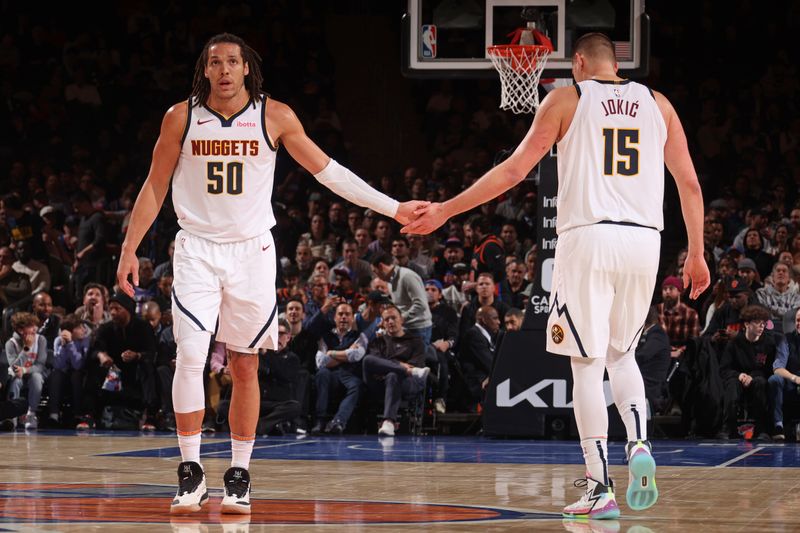 NEW YORK, NY - JANUARY 25: Aaron Gordon #50 and Nikola Jokic #15 of the Denver Nuggets high five during the game against the New York Knicks on January 25, 2024 at Madison Square Garden in New York City, New York.  NOTE TO USER: User expressly acknowledges and agrees that, by downloading and or using this photograph, User is consenting to the terms and conditions of the Getty Images License Agreement. Mandatory Copyright Notice: Copyright 2024 NBAE  (Photo by Nathaniel S. Butler/NBAE via Getty Images)