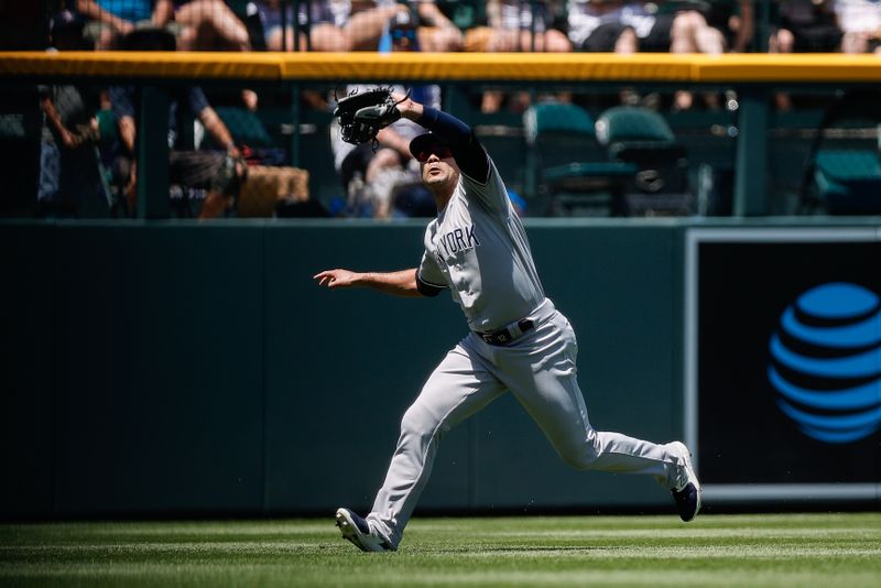 Jul 16, 2023; Denver, Colorado, USA; New York Yankees left fielder Isiah Kiner-Falefa (12) makes a catch in the second inning against the Colorado Rockies at Coors Field. Mandatory Credit: Isaiah J. Downing-USA TODAY Sports