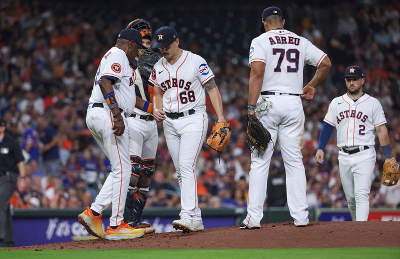 May 17, 2023; Houston, Texas, USA; Houston Astros starting pitcher J.P. France (68) walks off the mound after handing the ball to manager Dusty Baker Jr. (12) during a pitching change in the fourth inning against the Chicago Cubs at Minute Maid Park. Mandatory Credit: Troy Taormina-USA TODAY Sports