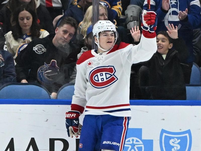 Nov 11, 2024; Buffalo, New York, USA; Montreal Canadiens right wing Cole Caufield (13) reacts to scoring a goal against the Buffalo Sabres in the second period at KeyBank Center. Mandatory Credit: Mark Konezny-Imagn Images